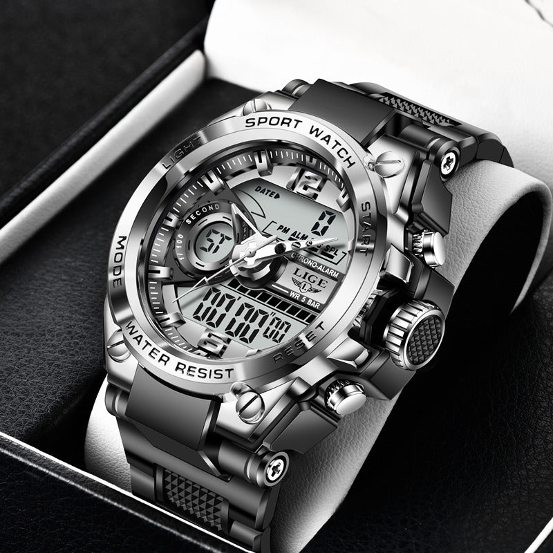 Silver digital sports watch with black strap on a dark background