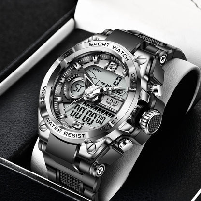Silver digital sports watch with black strap on a dark background