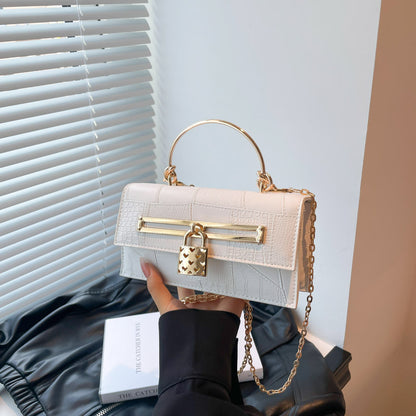 Women’s chain crossbody bag in white PU leather with gold-tone clasp bar and chain strap