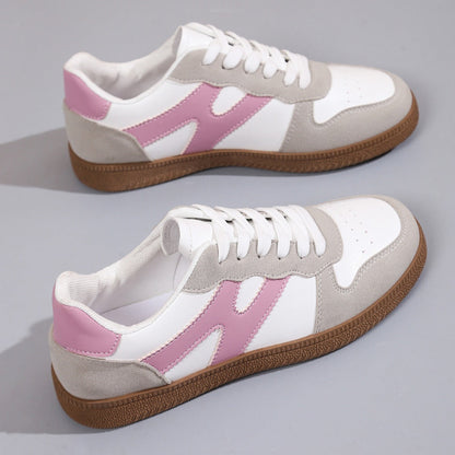 Women's low-top color-block sneakers, white with pink panels, lace-up design.