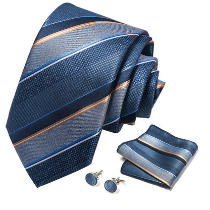 Blue striped tie with matching pocket square and cufflinks on a white background