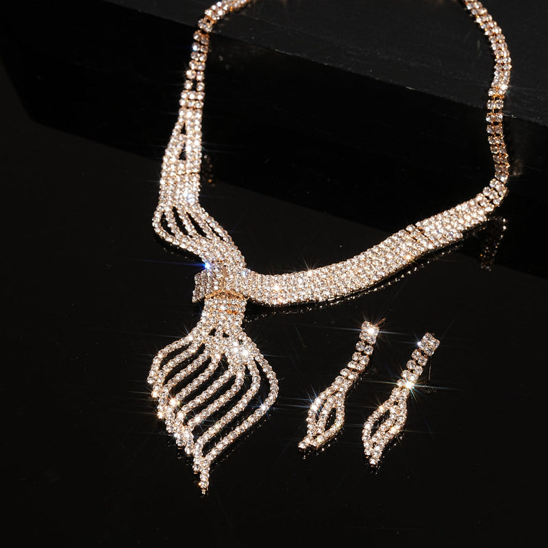 Diamante necklace and earrings set on a black background