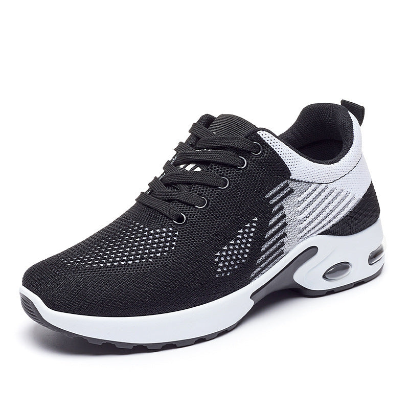 Black and white athletic shoe on a white background
