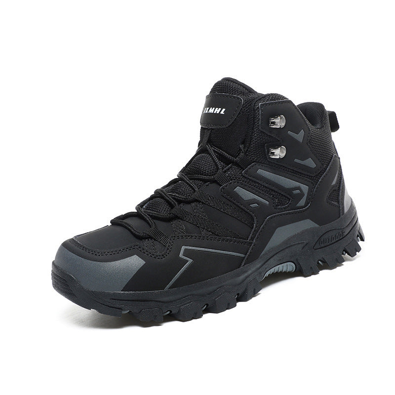Black hiking boot with gray accents on a white background