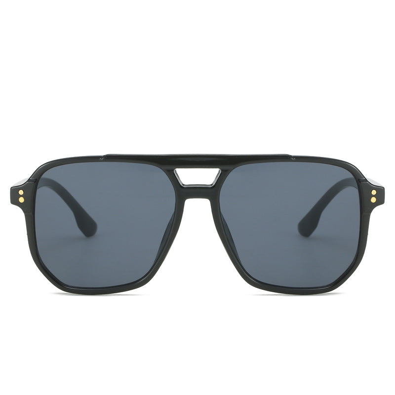 Black sunglasses with dark lenses on a white background
