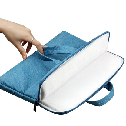 Blue laptop sleeve with a hand opening it on a white background