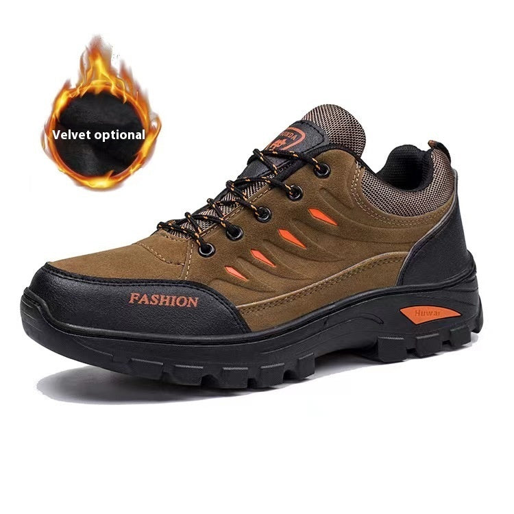 Brown and black hiking shoe with orange accents on a white background