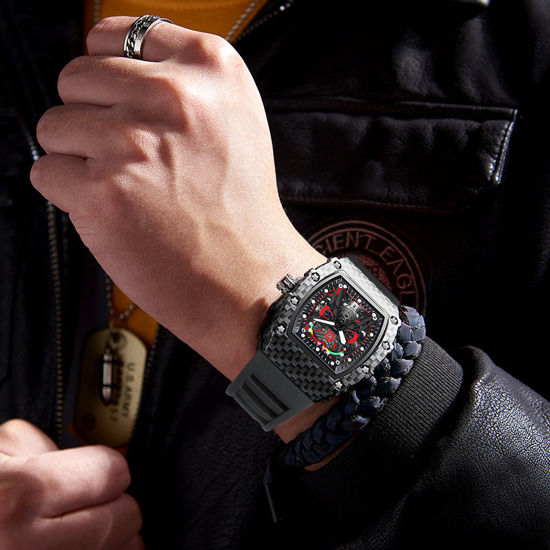 Close-up of a person wearing a luxurious watch with a black strap and intricate design.