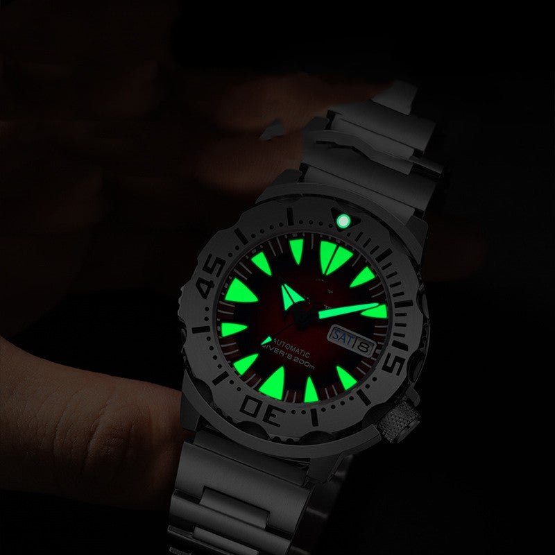 Diving Watch with a glowing Luminous face held in a hand against a dark background