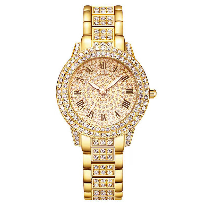 Gold wristwatch with diamond accents on a white background