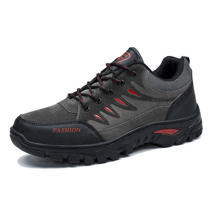 Gray and black sneaker with red accents on a white background