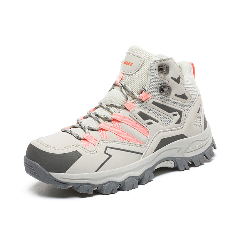 Gray and pink hiking boot on a white background