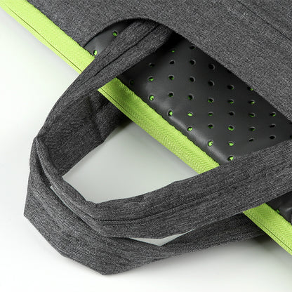 Gray backpack with green interior padding on a white background