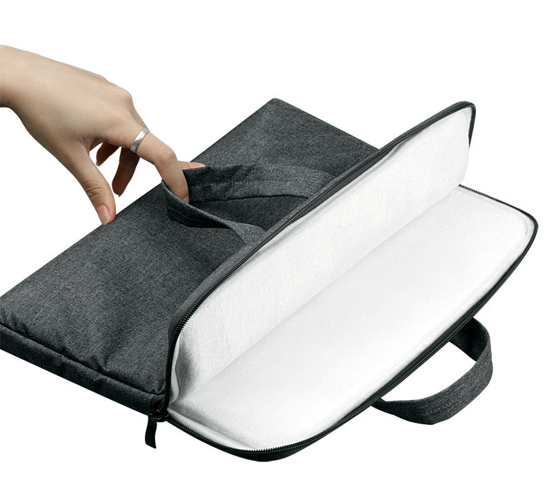 Gray laptop bag with a hand opening it on a white background