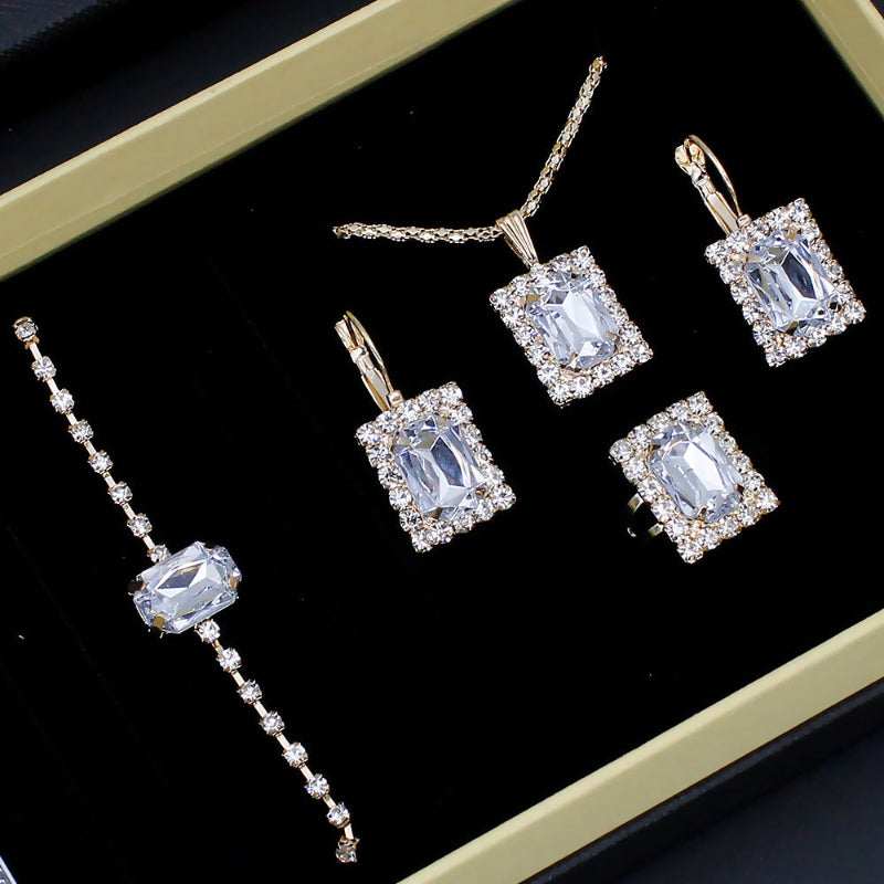 Jewelry set with square gemstones on a black background