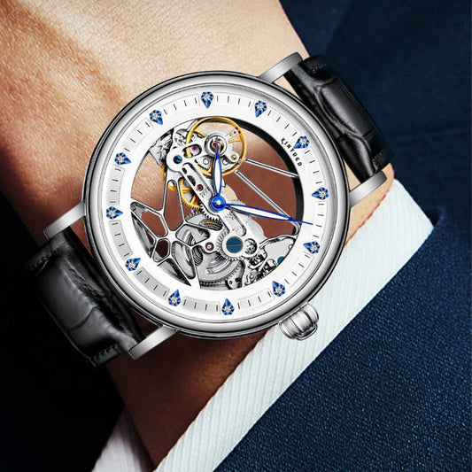 Silver skeleton automatic watch with black leather strap and blue hour markers