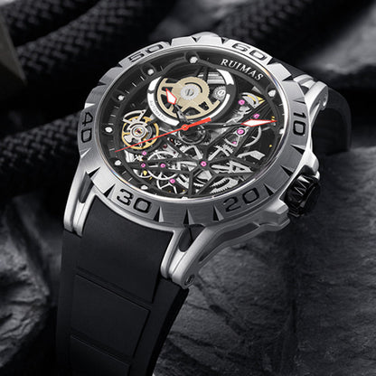 Mechanical watch with black strap and silver case on a dark textured background