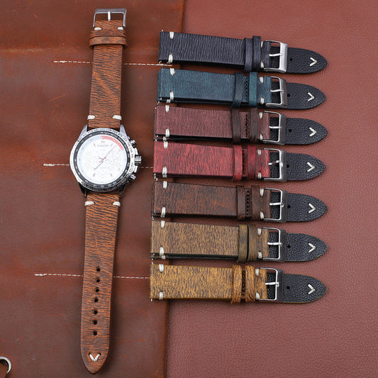 Set of patterned leather watch straps with metal buckles in dark and tan tones