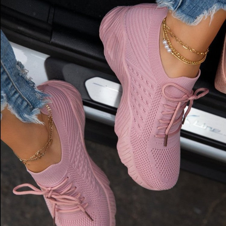 Pink women’s thick sole dad shoes with soft knit upper and sporty design
