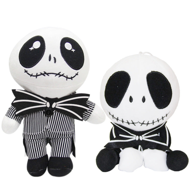 Two plush toys resembling a skeleton character with black and white striped outfits on a white background