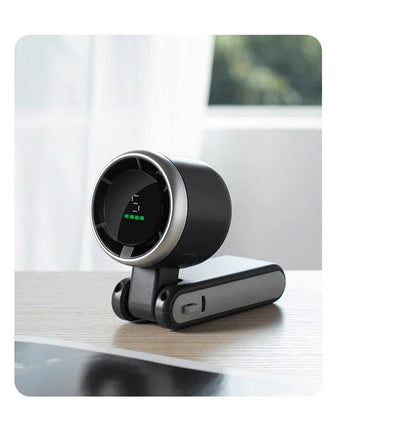 Black foldable mini desktop fan with circular grille and short arm stand