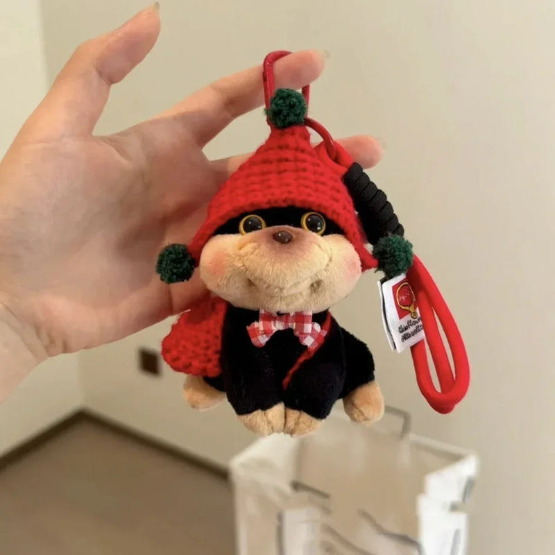 Puppy plush keychain with red knit hat, green pom-poms, on red strap with tag