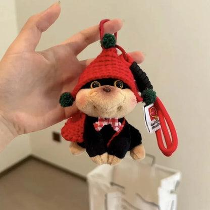 Puppy plush keychain with red knit hat, green pom-poms, on red strap with tag