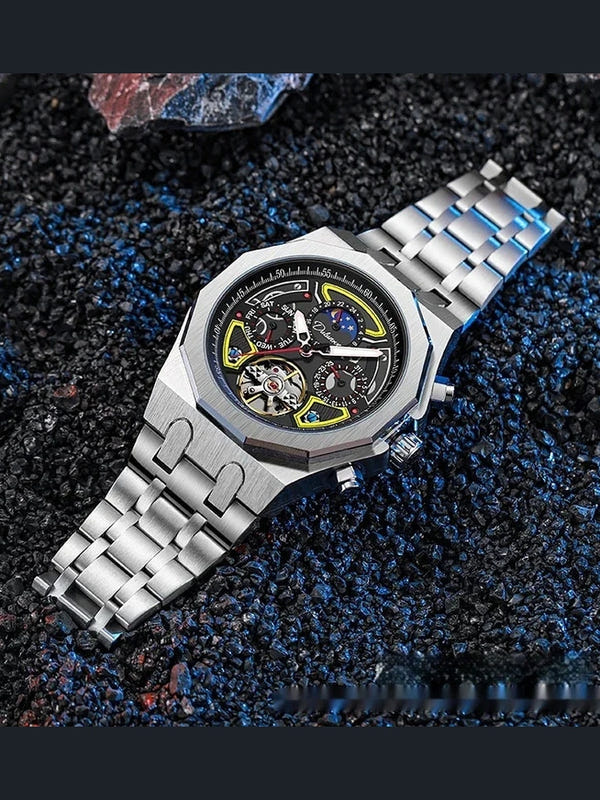 Men's automatic sports watch with silver case and metal bracelet, black dial, yellow and blue accents