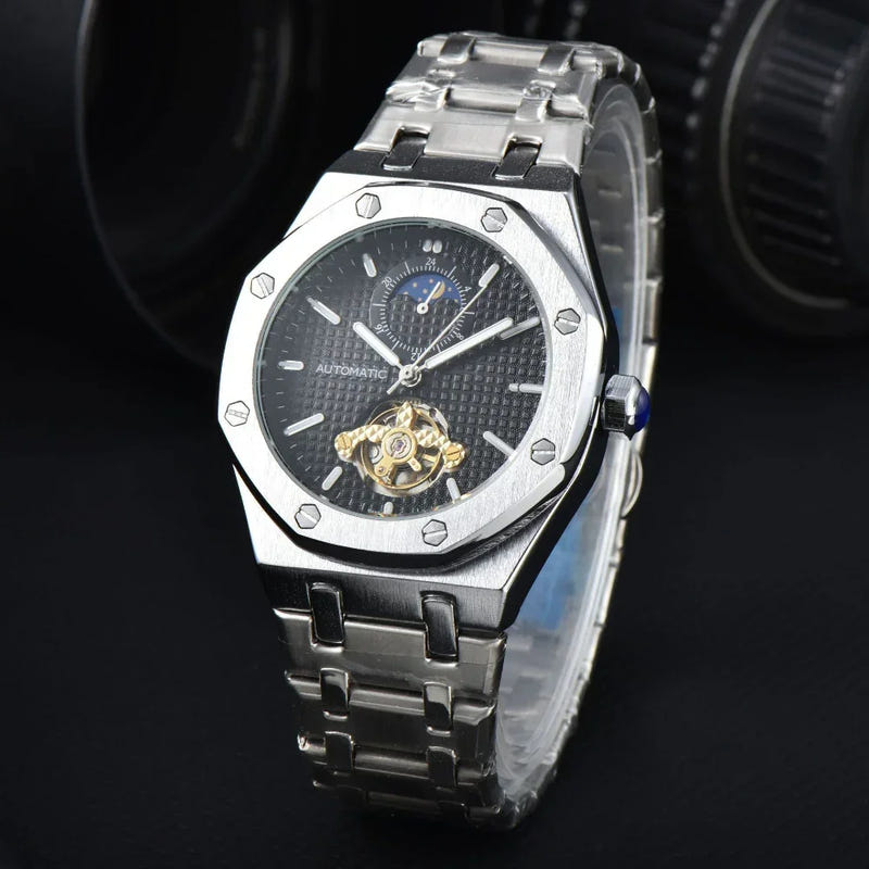 Men’s automatic mechanical watch with silver stainless bracelet and black dial, gold movement visible