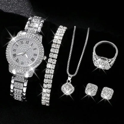Silver jewelry set including a watch, bracelet, necklace, ring, and earrings on a black background.