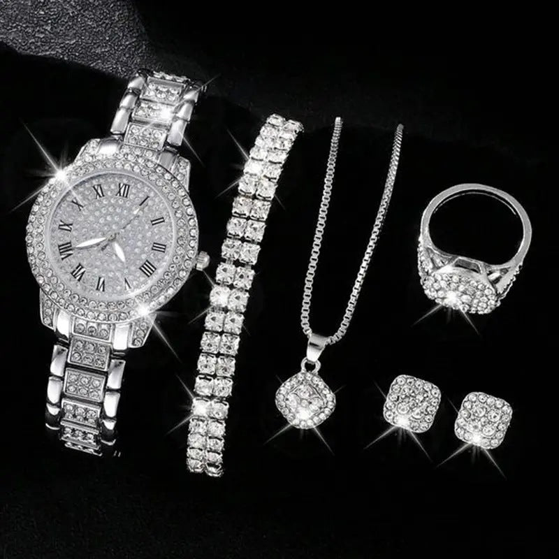 Silver jewelry set including a watch, bracelet, necklace, ring, and earrings on a black background.