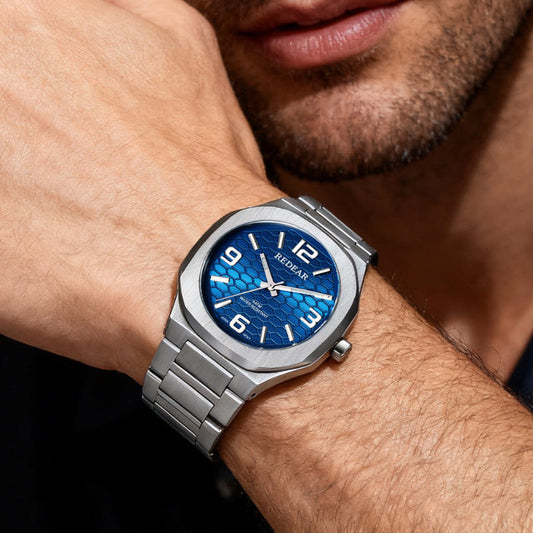 Men's quartz watch with silver metal bracelet and blue patterned dial, bold numerals