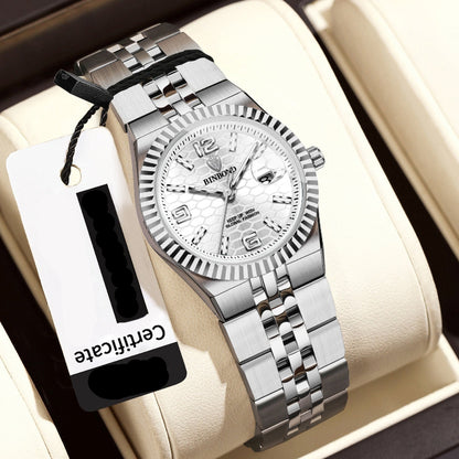 Silver wristwatch with a certificate tag on a beige cushion