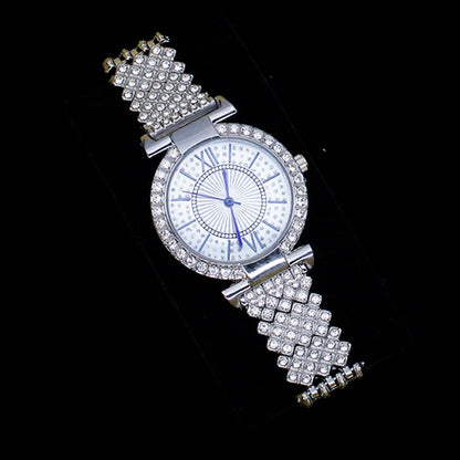 Silver wristwatch with gemstone-encrusted band on a black background