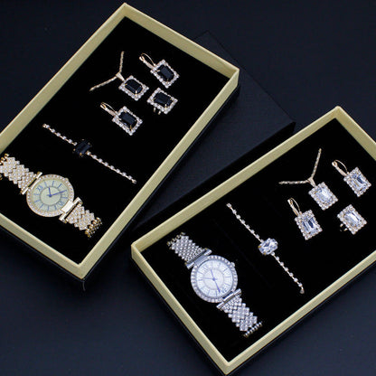 Silver-tone watch, rhinestone earrings, and bracelet set in two gift boxes