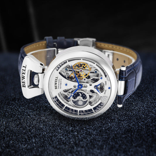 Men's skeleton automatic watch with silver case, blue leather strap, openwork dial