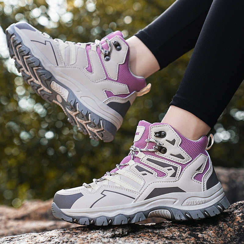 White and purple hiking boots on a blurred natural background