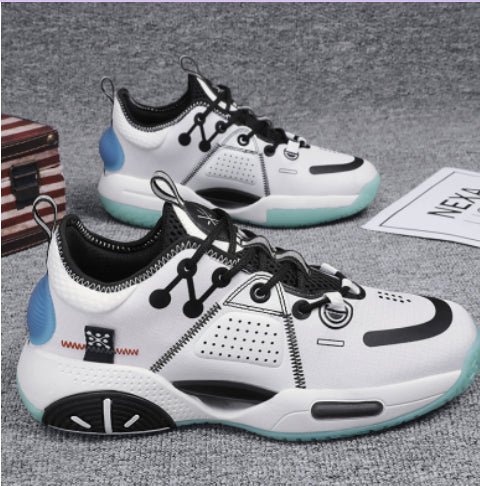 White sneakers with black and blue accents on a gray surface