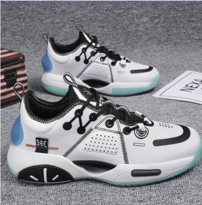 White sneakers with black and blue accents on a gray surface