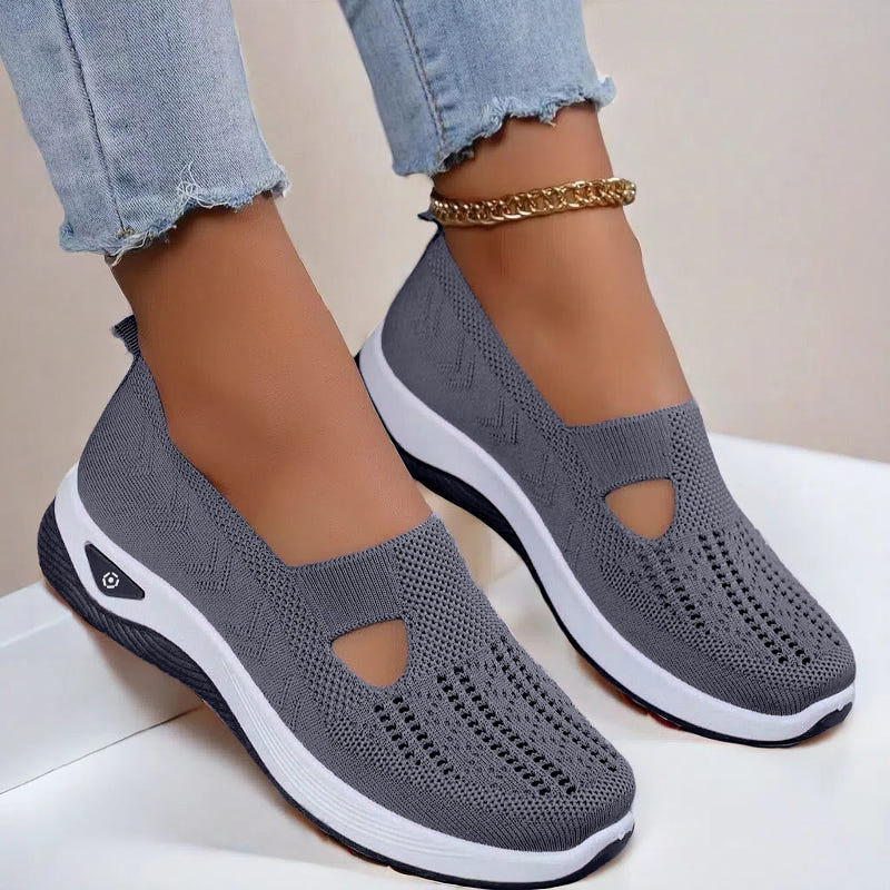 Women’s mesh flats in dark gray, breathable slip-on with cutout toe and white sole
