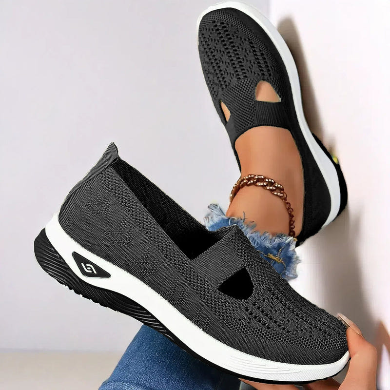 Women’s mesh flats in black, breathable slip-on with cutout toe and white sole