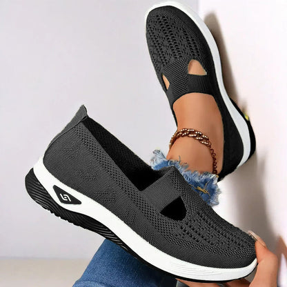 Women’s mesh flats in black, breathable slip-on with cutout toe and white sole