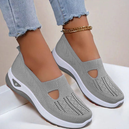 Women’s mesh flats in gray, breathable slip-on with cutout toe and white sole