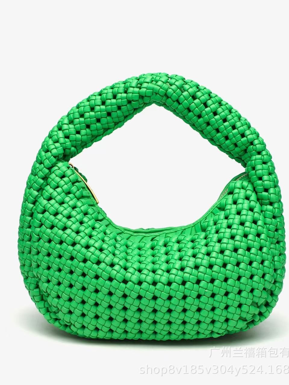 Green woven handbag on a white background