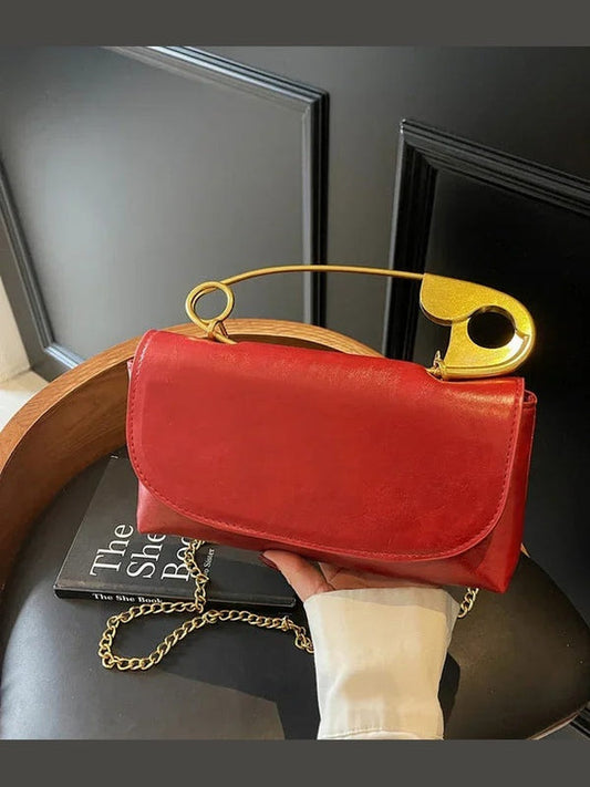 Wine red PU leather shoulder bag with gold ring handle and chain strap, flap closure