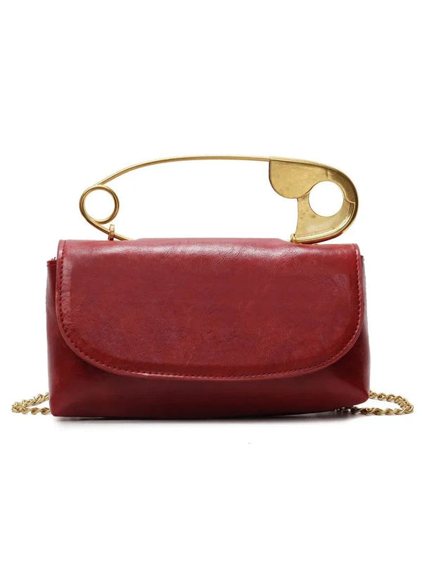 Wine red PU leather crossbody bag with gold top handle ring and chain strap, flap