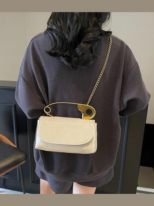 Beige PU leather shoulder bag with gold ring handle and chain strap, flap closure