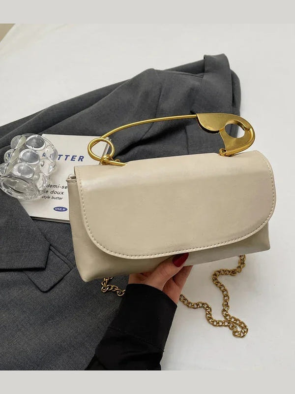 Beige PU leather shoulder bag with gold ring handle and chain strap, curved flap