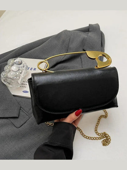 Dark gray PU leather shoulder bag with gold ring handle and chain strap, flap closure
