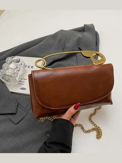 Brown PU leather shoulder bag with gold ring handle and chain strap, flap closure